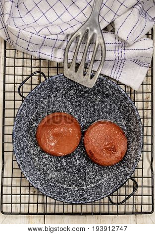 grilled scalded sausage with olive oil in a pan