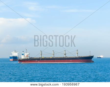 Logistic conceptCargo ship anchored Near the landing point at sea.