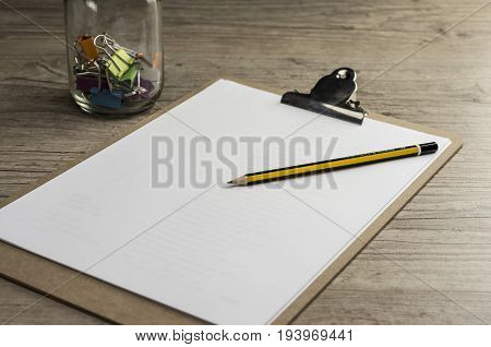 Close up shot of a pencil on cilp pad