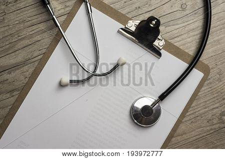 Close up shot of a stethoscope on a cilp pad