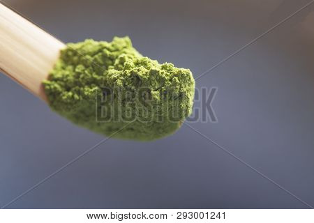 Green Tea Matcha In A Spoon On A Dark Surface. Close Up Shot