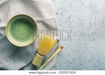 Top View Of Green Tea Matcha In A Bowl On Concrete Surface With Copy Space