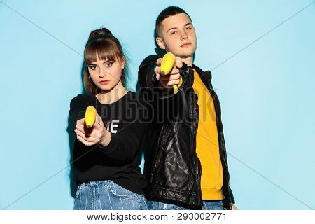 Smash Outright. Close Up Fashion Portrait Of Two Young Cool Hipster Girl And Boy Wearing Jeans Wear.