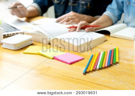 Woman And Man Work On The Table