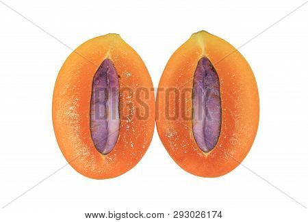 Cross Section Of Marian Plum Showing Its Juicy Flesh And Purple Seed Isolated On White Background