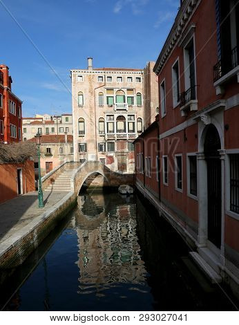 Ancient Palace And The Old Brdige Over The Navigable Waterway In Venice Italy