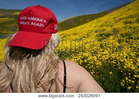Taft, California - March 25, 2019: Blonde Woman Wearing A Donald Trump Make America Great Again Hat,
