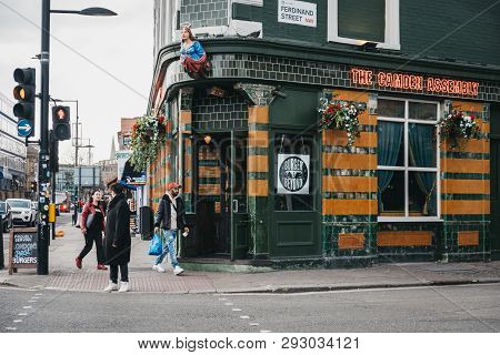 London, Uk - March 23, 2019: People Walking Past The Camden Assembly Pub In Camden, London, An Area 