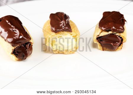 Traditional French Dessert. Eclair With Chocolate Icing. Pastery Concept With Chocolate Eclair