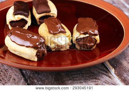 Traditional French Dessert. Eclair With Chocolate Icing. Pastery Concept With Chocolate Eclair