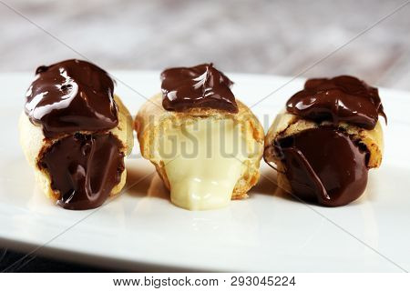 Traditional French Dessert. Eclair With Chocolate Icing. Pastery Concept With Chocolate Eclair