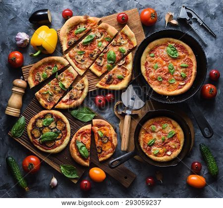 Flatlay Of Healthy Rustic Vegetarian Pizza Party. Homemade Pizzas With Tomatoes, Mushrooms, Bell Pep