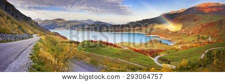 Mountains And Lake Roselend  With A Dike
