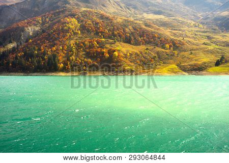 Aerial Morning View Of Roselend Lake/lac De Roselend. Picturesque Autumn Scene Of Auvergne-rhone-alp