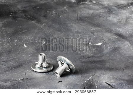 Two Metal Grey Fasteners For Gluing On Left Part Of Oblong Shot On Background Of Black Chalkboard Ru