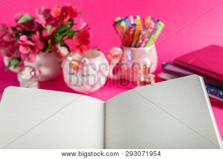 Open Notebook, Unicorn Mugs, Llama Squishy, And Flamingo Mug With Colorful Gel Pens And Stationery O