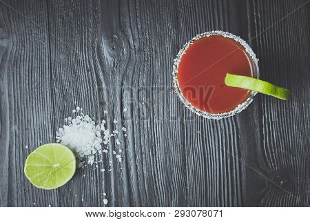 Cocktail Bloody Mary Or Caesar With Lemon And Lime On A Black Wood Background