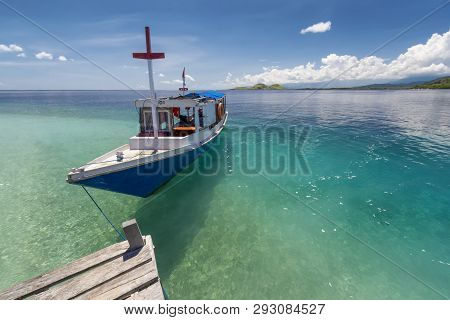 Beautiful Clean Sea In Kenawa Indonesia With Boat For Transportation To The Location
