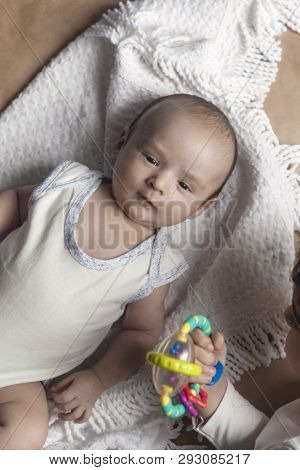 Two Brothers Lying And Posing. Portrait Of Brothers. Two Months Baby Boy And Five Years Small Boy Pl
