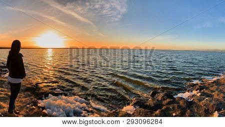 San Jose, California (usa) - March 29, 2019. Lady Enjoying The Beautiful Sunset At Lake Alviso Marin