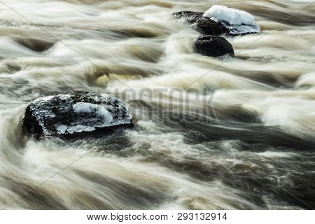 Long Exposure Photo. Rough River Jokelanjoki And Stones In Water, Kouvola, Finland.
