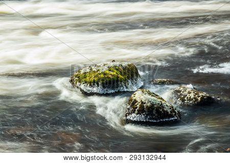 Long Exposure Photo. Rough River Jokelanjoki And Stones In Water, Kouvola, Finland.