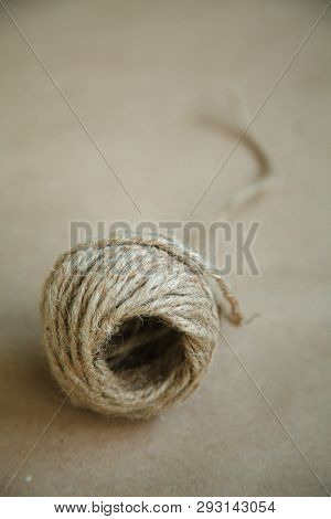 Torso Of Twine On A Brown Background. Selective Focus, Vertically.
