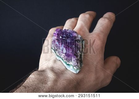 Druse Of Natural Untreated Violet Crystals Of Amethyst On A Piece Of Rock Lies On The Palm Of Your H