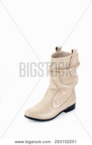 Beige Woman Long Boot Shoe Isolated On White Background. Fashionable Boots For Women May Exhibit All