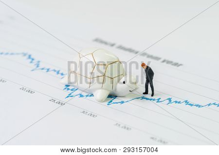 Miniature People Businessman Standing With Turtle Or Tortoise On Rising Growth Stock Market Value Pr