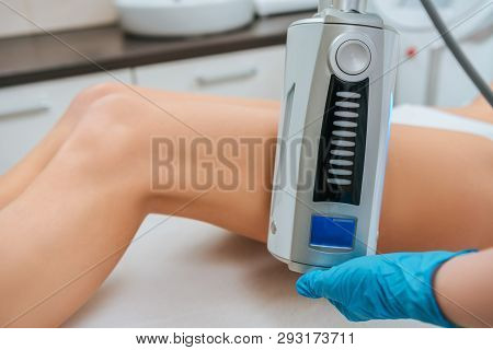 Cropped View Of Cosmetologist Doing Endospheres Therapy For Leg