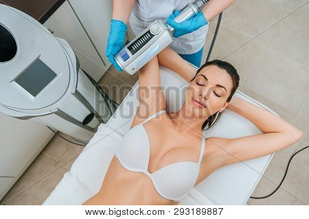 Cropped View Of Cosmetologist Doing Endospheres Therapy For Arm