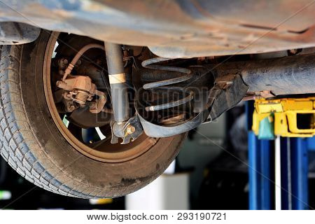 The Under View Of The Whell,tire ,shock Up And Spring Of The   Car At Repair Shop