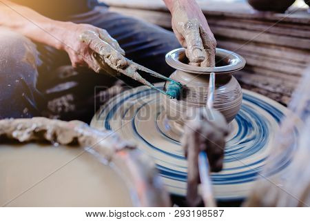 Pottery, Workshop, Ceramics Art Concept - Closeup On Male Hands Sculpt New Utensil With A Tools And