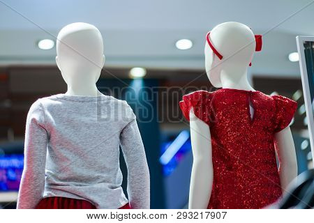 Fashion Kids On Statue In Cloth In Departmenstore