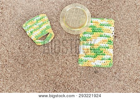 Summer Items - Sun Hat, Bag, Towel On Sandy Beach. Summer Background. Copy Space.