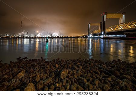 Rotterdam, 21 March 2019 - View Of The Botlek Bridge At The Entrance Of Rotterdam City By Boats Refl