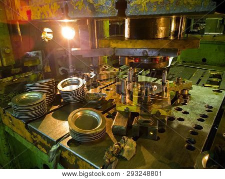 Dirty Used Low Tech Stamping Press Producing Round Aliminium Parts