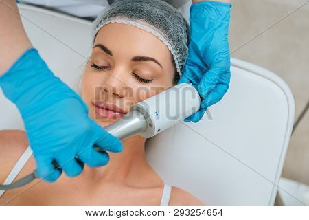 Partial View Of Cosmetologist Doing Endospheres Therapy For Face