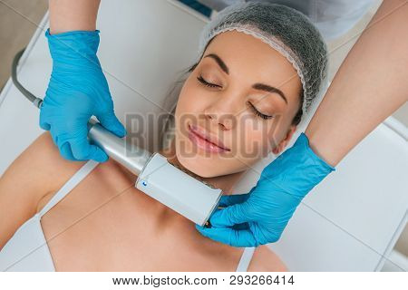 Cropped View Of Cosmetologist Doing Endospheres Therapy For Neck
