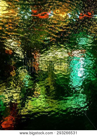 Colorful Glass Textures In Front On Deem Light Source