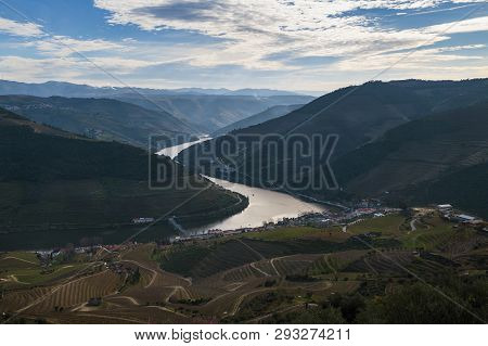 View Of The Pinhao Village With Terraced Vineyards And The Douro River, In Portugal; Concept For Tra
