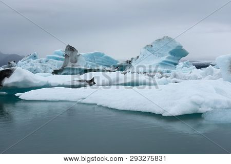 Extraordinary Icebergs In The Glacier Lagoon, Jokulsarlon. The Blue Is From The Pure Compressed Ice 