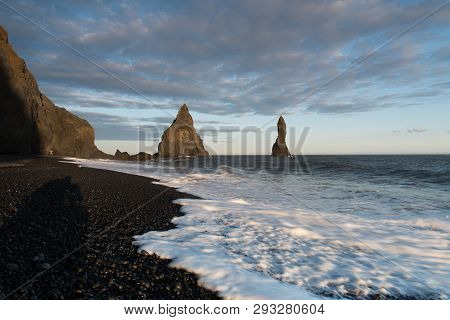Amous Reynisdrangar Rock Formations At Black Reynisfjara Beach. Coast Of The Atlantic Ocean Near Vik