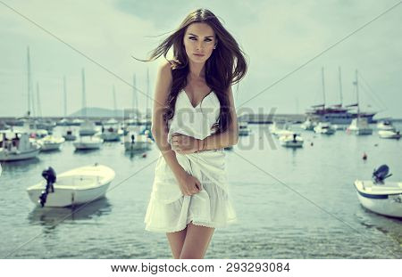 Young Delicate Brunette Woman Posing In Port