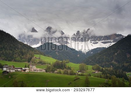 Dramatic Landscape And Dark Cloud Over Val Di Funes Dlomite Italy