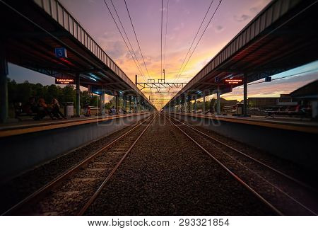 Jakarta, 1 April 2019 : Tigaraksa Krl Commuter Line Train Station At Sunset With Two Line Of Railroa