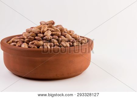 A Plate Of Beans On White Background