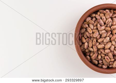 A Plate Of Beans On White Background