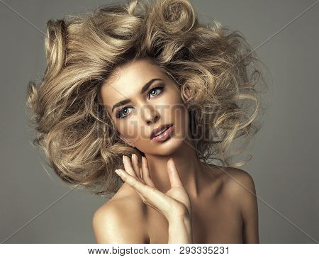 Beautiful Blond Woman With Curly Long Hair